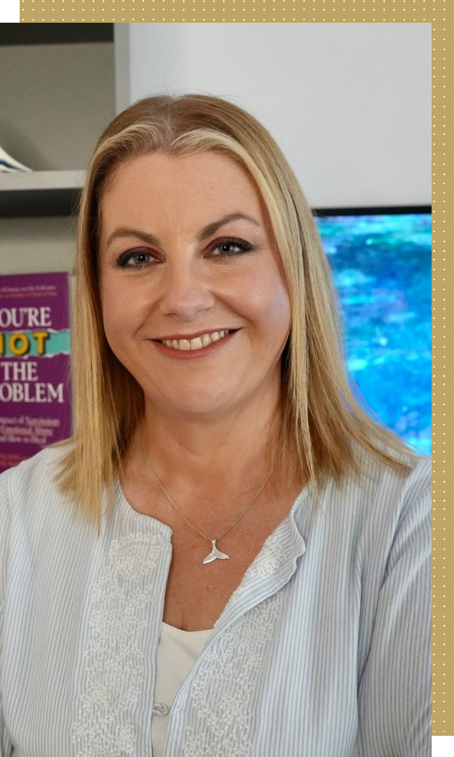 Helen is smiling in front of a bookcase, with shoulder length blonde hair and a pale blue top.